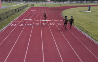 monarch-track-running students