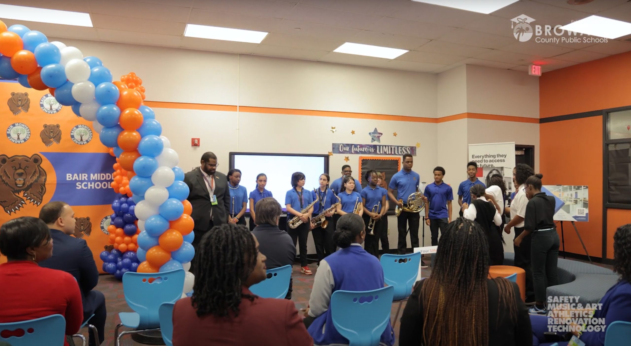 People standing next to balloons