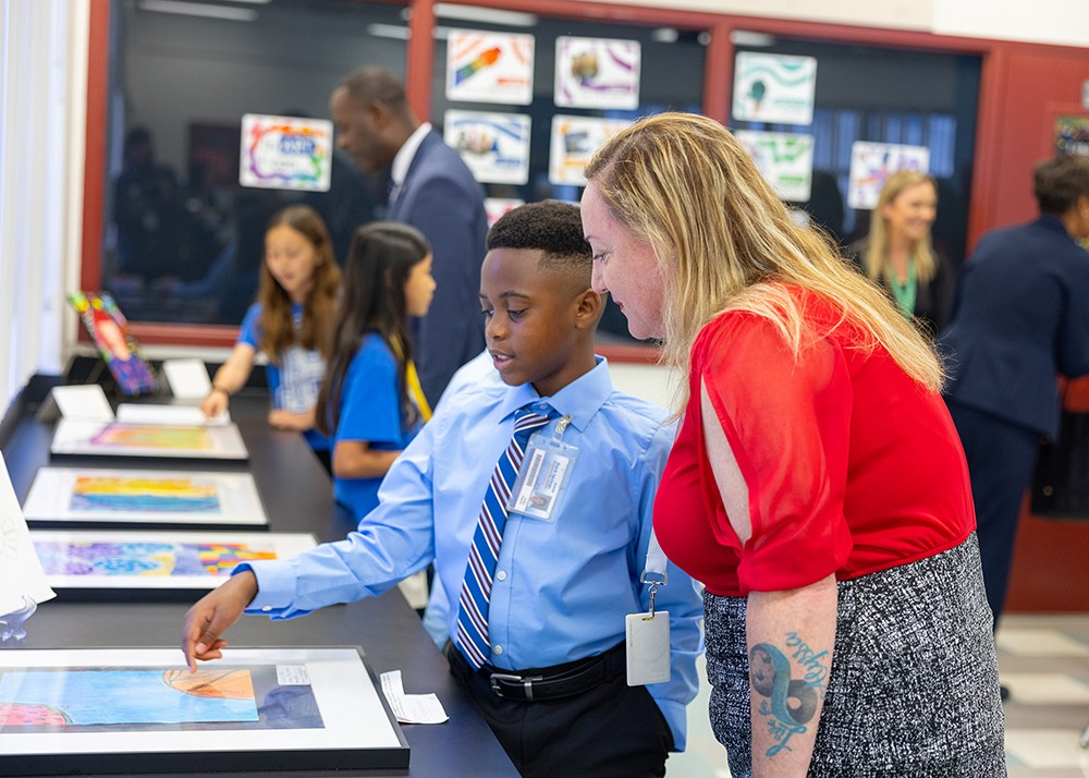 Student interacting with a teacher.