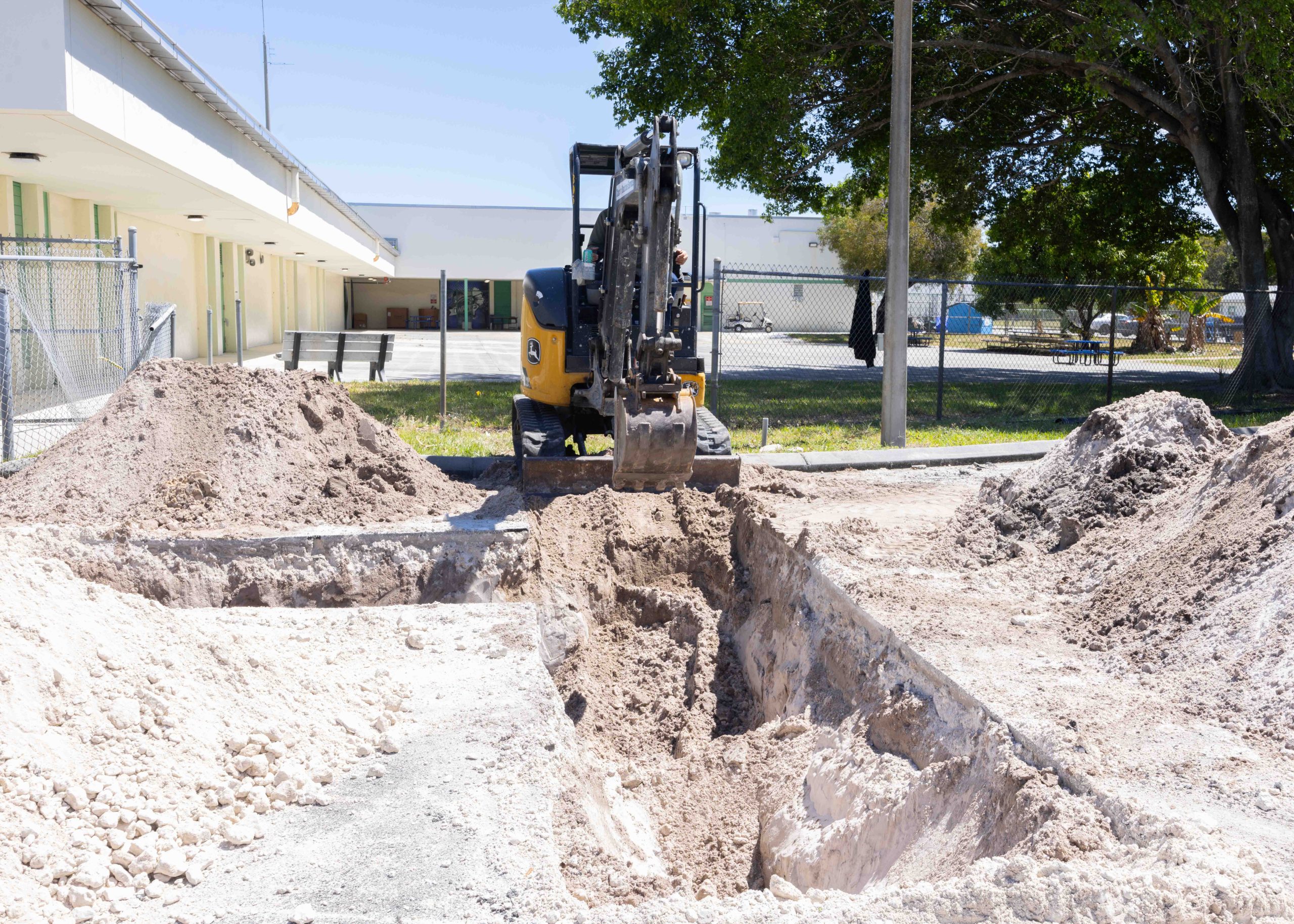 Construction machine digging a trench