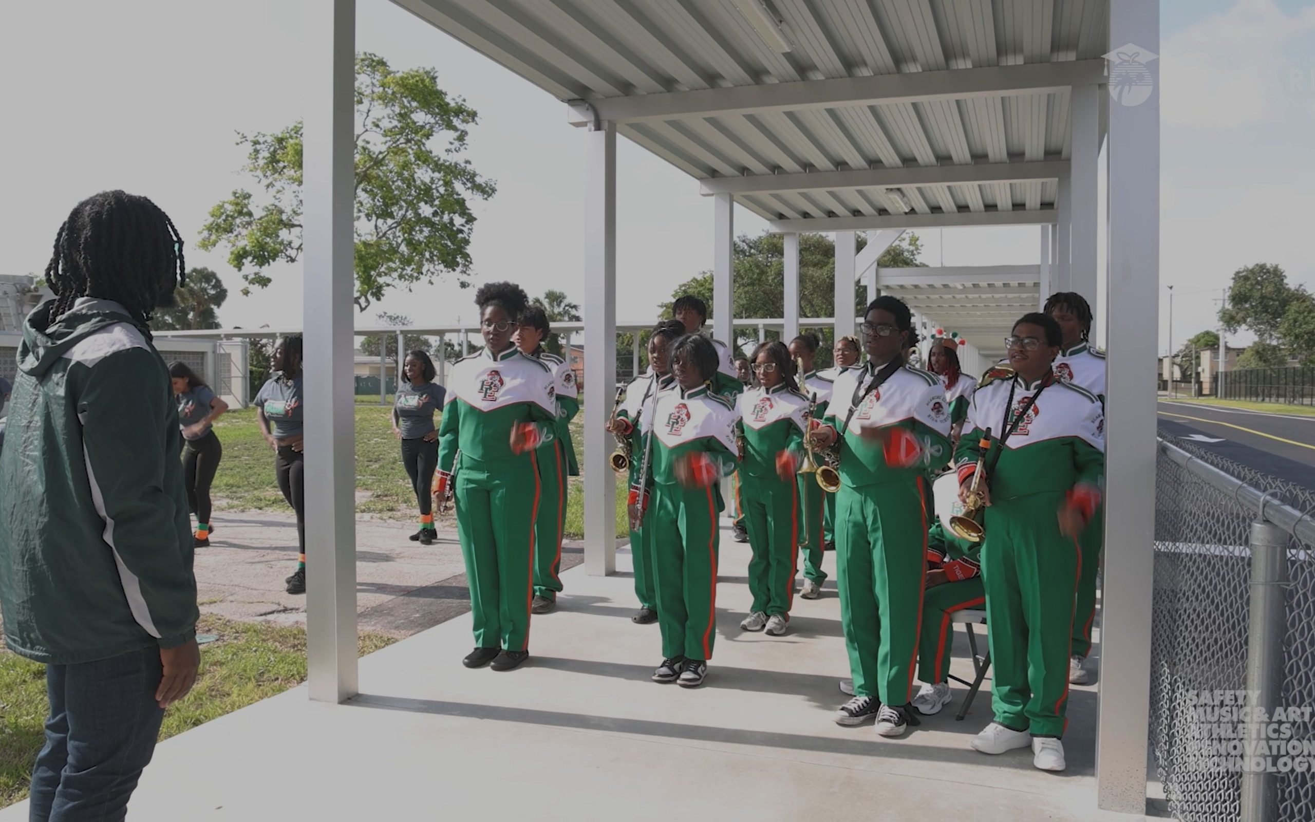 School band in a group setting for a ribbon cutting ceremony